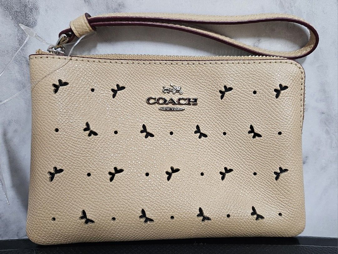 Beige coach wristlet best sale