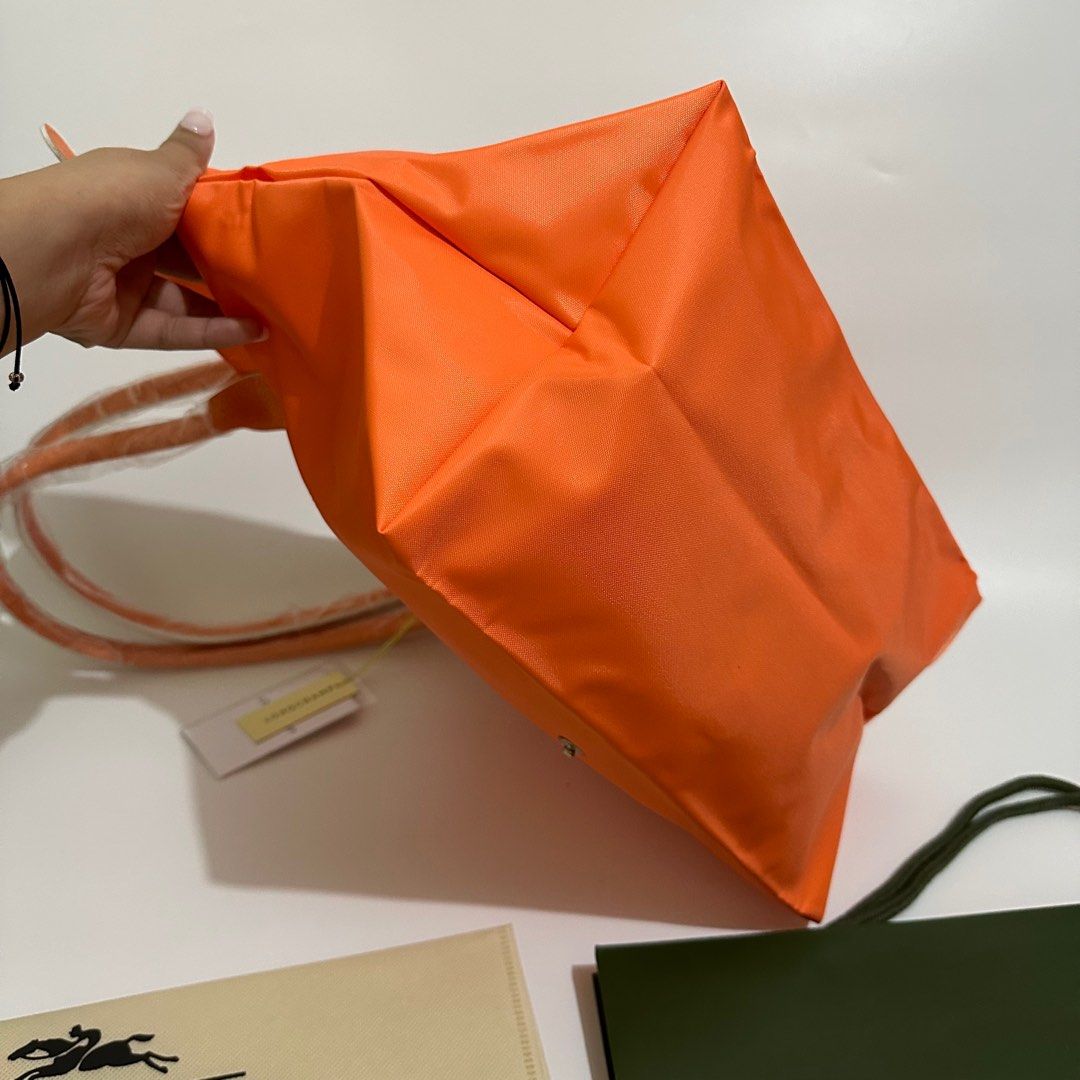 Longchamp Club Long Handle (Category: Luxury Bags & Wallets) located in Makati City. Submitted by lux.mariah (Listing ID 1270234323, Image 3). Description: Guaranteed Auth 💗 Longchamp Club Orange color Brand new Complete inclusions Can fit laptop / ipad Very spacious Courier lalamove j&t and LBC.