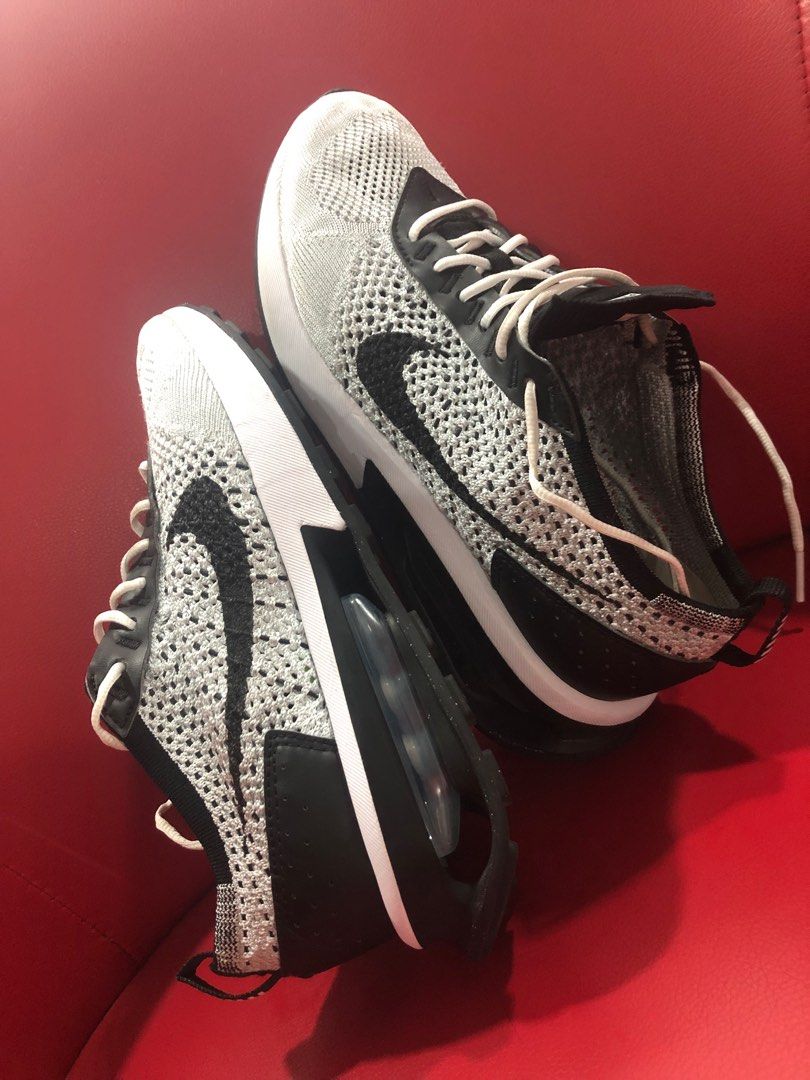 Nike flyknit racer black white jordan hot sale