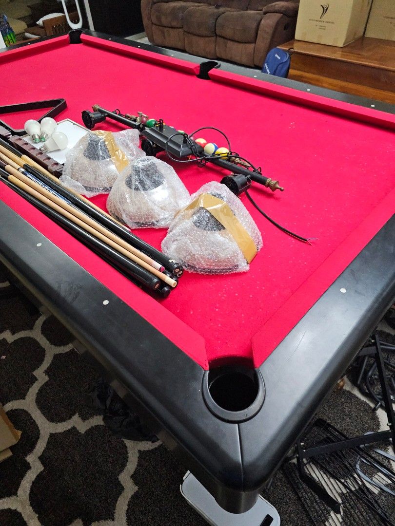 Pool Table (Category: Racket & Ball Sports) located in Singapore. Submitted by happyfox.73eb39 (Listing ID 1270203759, Image 2). Description: Parting ways with my cherished 8ft American pool table, a gem in excellent condition. Complete with balls, 3 cues, and a stunning set of lights. Asking for $700 SGD, open to negotiation. Self-collect, arrange your mover. Sadly, my move to a cozier space means it needs a new home. If interested, let's chat f