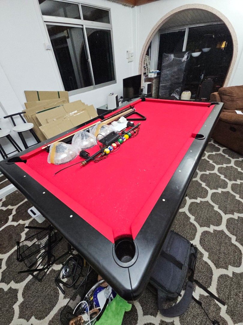 Pool Table (Category: Racket & Ball Sports) located in Singapore. Submitted by happyfox.73eb39 (Listing ID 1270203759, Image 5). Description: Parting ways with my cherished 8ft American pool table, a gem in excellent condition. Complete with balls, 3 cues, and a stunning set of lights. Asking for $700 SGD, open to negotiation. Self-collect, arrange your mover. Sadly, my move to a cozier space means it needs a new home. If interested, let's chat f