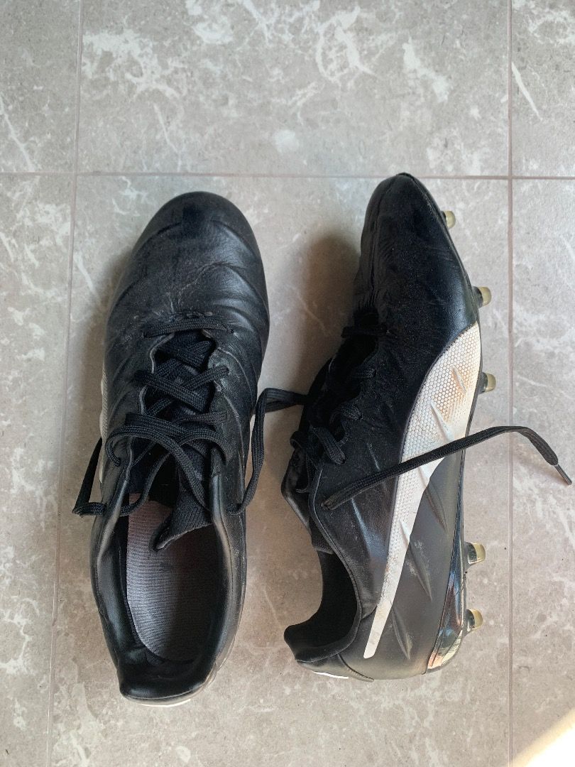 Puma football hotsell shoes black