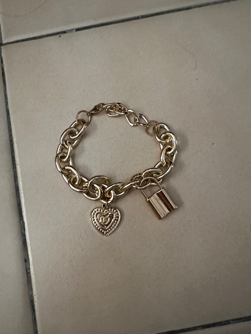 Gold bracelet deals with heart locket