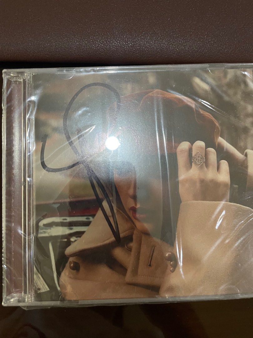 Taylor Swift Signed RED CD (Category: CDs & DVDs) located in Manila. Submitted by stefandraboutique (Listing ID 1270102501, Image 1). Description: on hand and ready to ship taylor swift signed red cd 🥰.