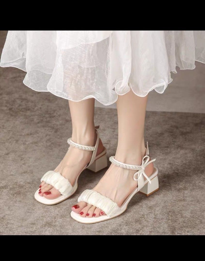 white sandal heels buckle type