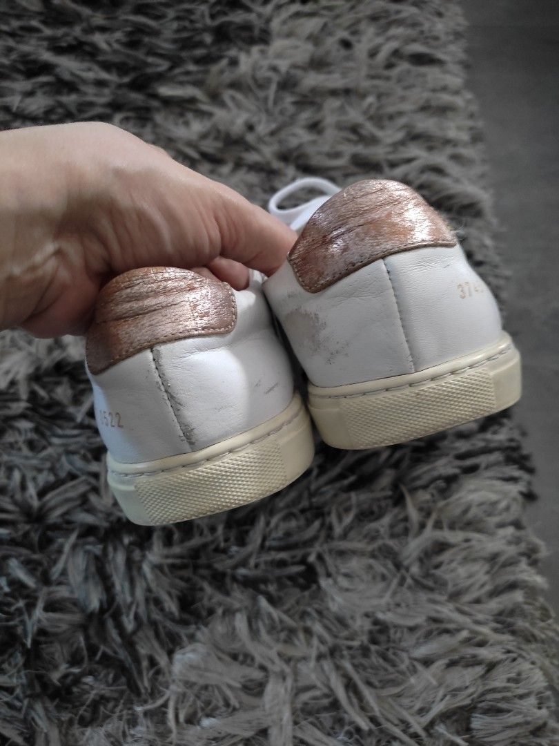 Women by Common Projects Achilles Low Sneakers (Category: Sneakers) located in Tarlac. Submitted by momma02 (Listing ID 1270439615, Image 3). Description: Preloved Original Achilles Low Common Project Womens Sneakers White | Rosegold Got this pair from a carouseller.Im a size 6.5 sobrang gusto ko yung sneakers pero di po kasya kahit naglagay ako ng shoe inserts😢 size runs big pala sa brand na ito. size posted is 37 Womens 24 cm but in actual sin