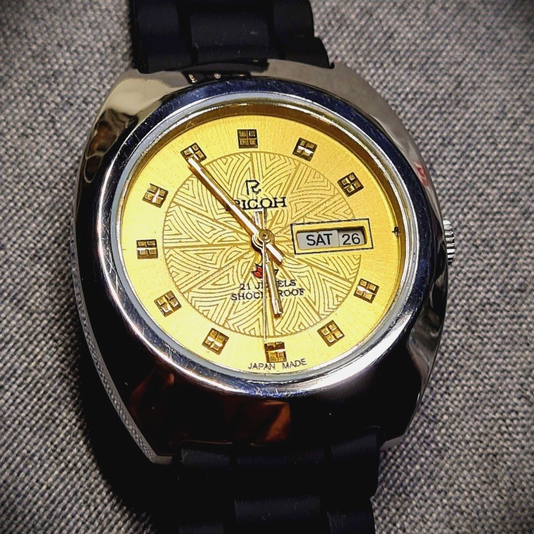 Golden Ricoh Watch - Automatic - Japan Made (Category: Luxury Watches) located in Caloocan City. Submitted by allig8 (Listing ID 1243878505, Image 1). Description: Very beautiful Automatic Watch Ricoh - Made in Japan 21 Jewels Bumpy Black Rubber Jelly Strap Diameter 39.4 mm Thick Watch Keeps good time At least 18 hours power reserve Selling for 3.5K only!!! WYSIWYG Please be reminded that you are not buying a brand new watch, so don't expect it t