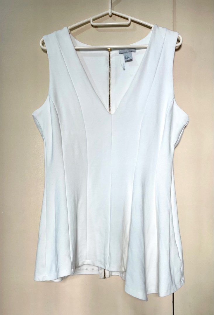 H&M Asymmetrical Peplum Top (Category: Blouses) located in Marikina City. Submitted by micharon (Listing ID 1270348117, Image 1). Description: L on tag, fits up to XL.