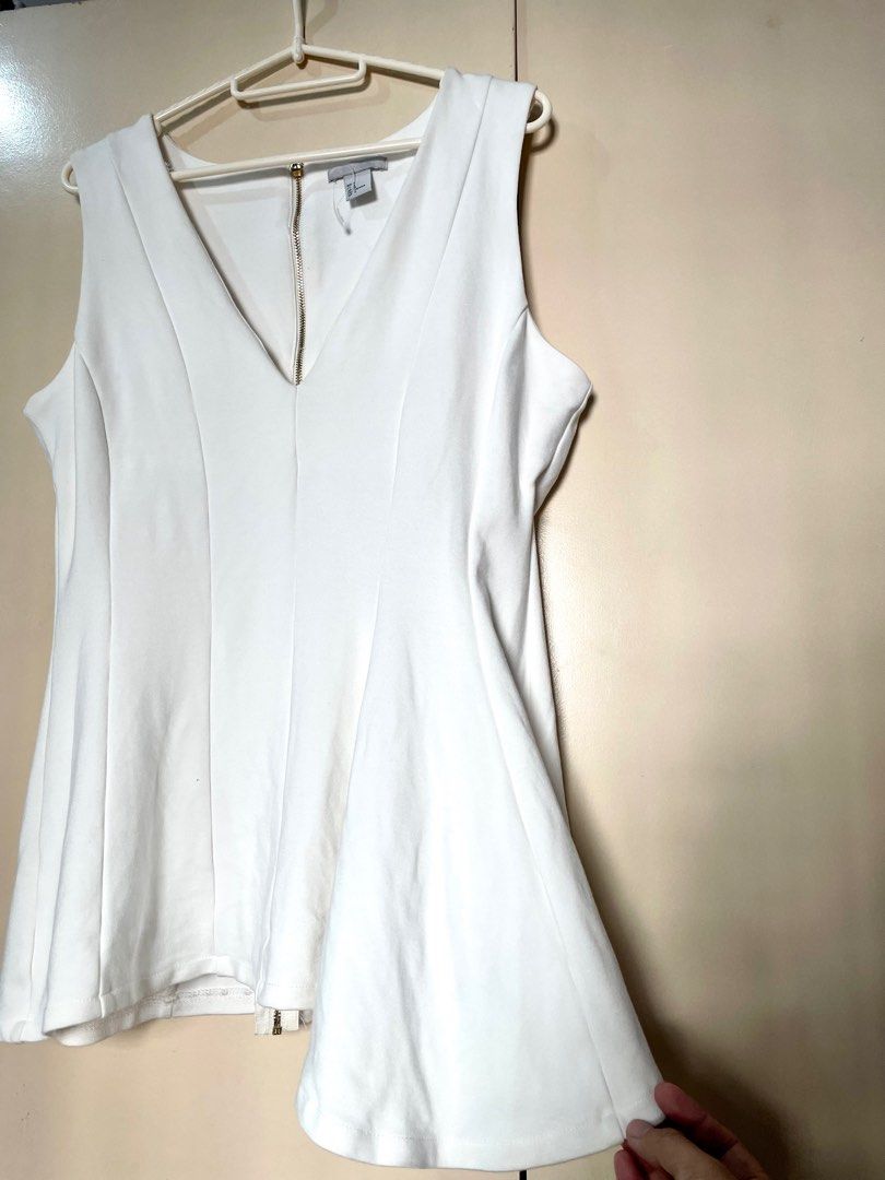 H&M Asymmetrical Peplum Top (Category: Blouses) located in Marikina City. Submitted by micharon (Listing ID 1270348117, Image 2). Description: L on tag, fits up to XL.