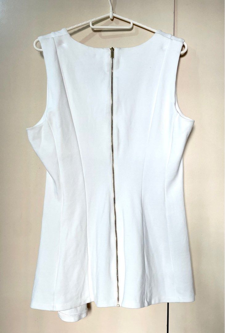 H&M Asymmetrical Peplum Top (Category: Blouses) located in Marikina City. Submitted by micharon (Listing ID 1270348117, Image 3). Description: L on tag, fits up to XL.