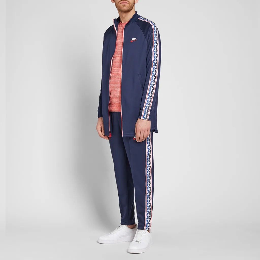 Nike taped poly track pants online