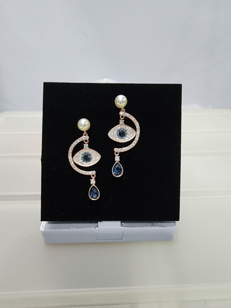 Swarovski duo hotsell evil eye earrings