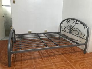 Wrought iron bed with bed side table