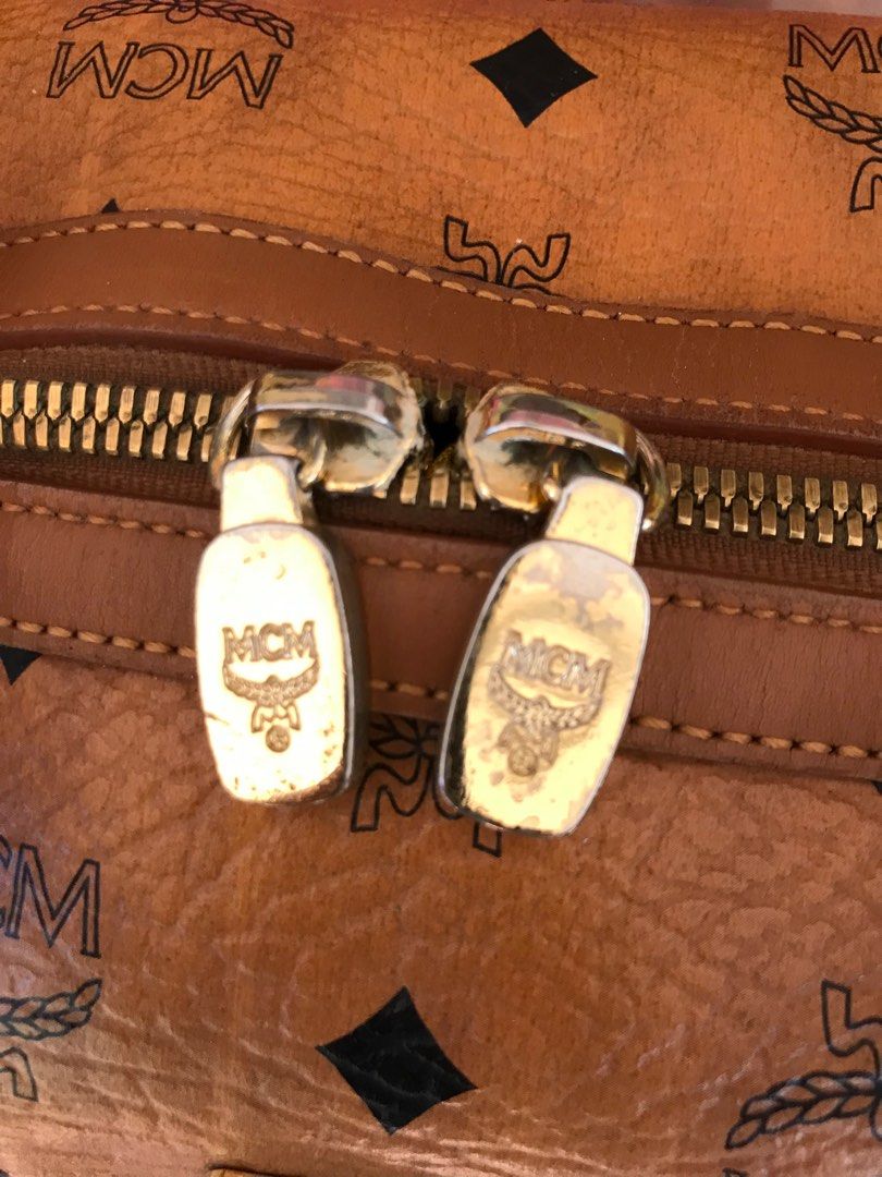Preloved MCM Boston HandBag Cognac with charm (Category: Luxury Bags & Wallets) located in Manila. Submitted by lala168 (Listing ID 1214688252, Image 3). Description: Preloved MCM Boston Bag Cognac with gold charm Slighty used ; Clean Minimal sign of use Handbag .