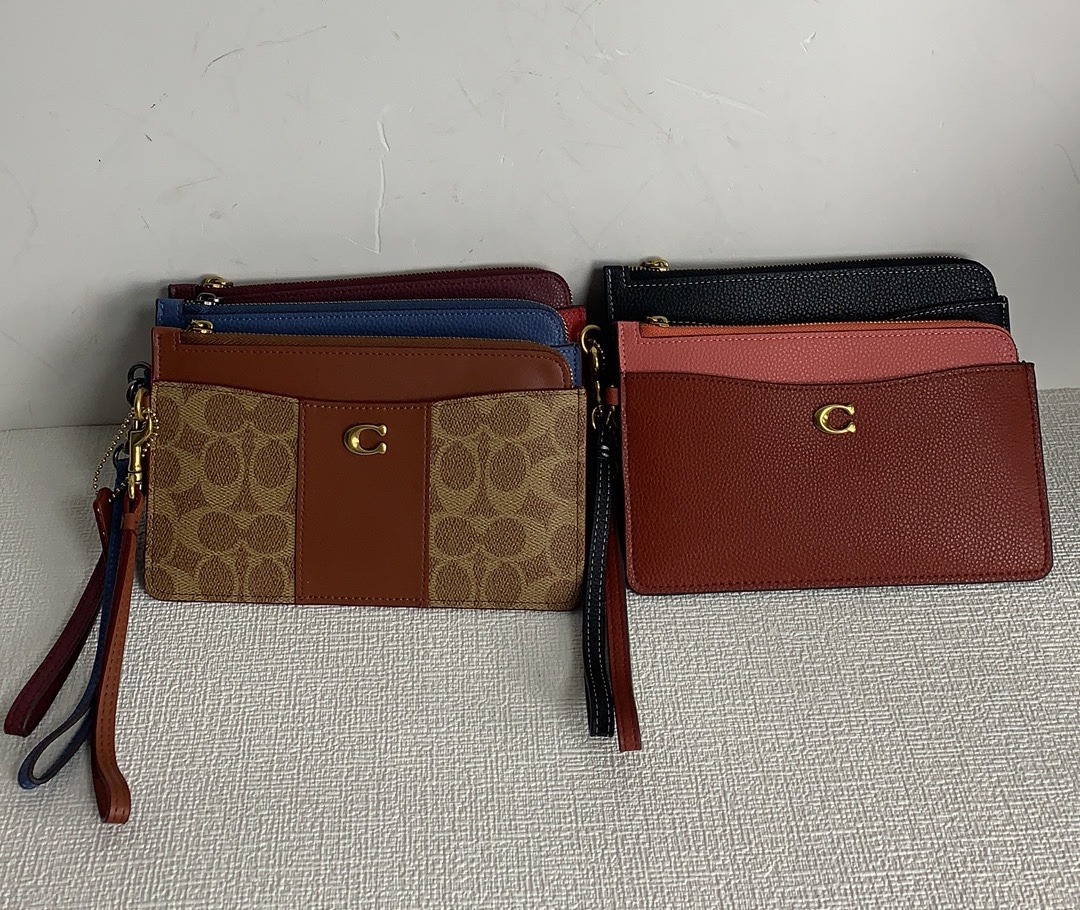 mehtavasudha - COACH MULTI POCHETTE. NEXT TO ORIGINAL.