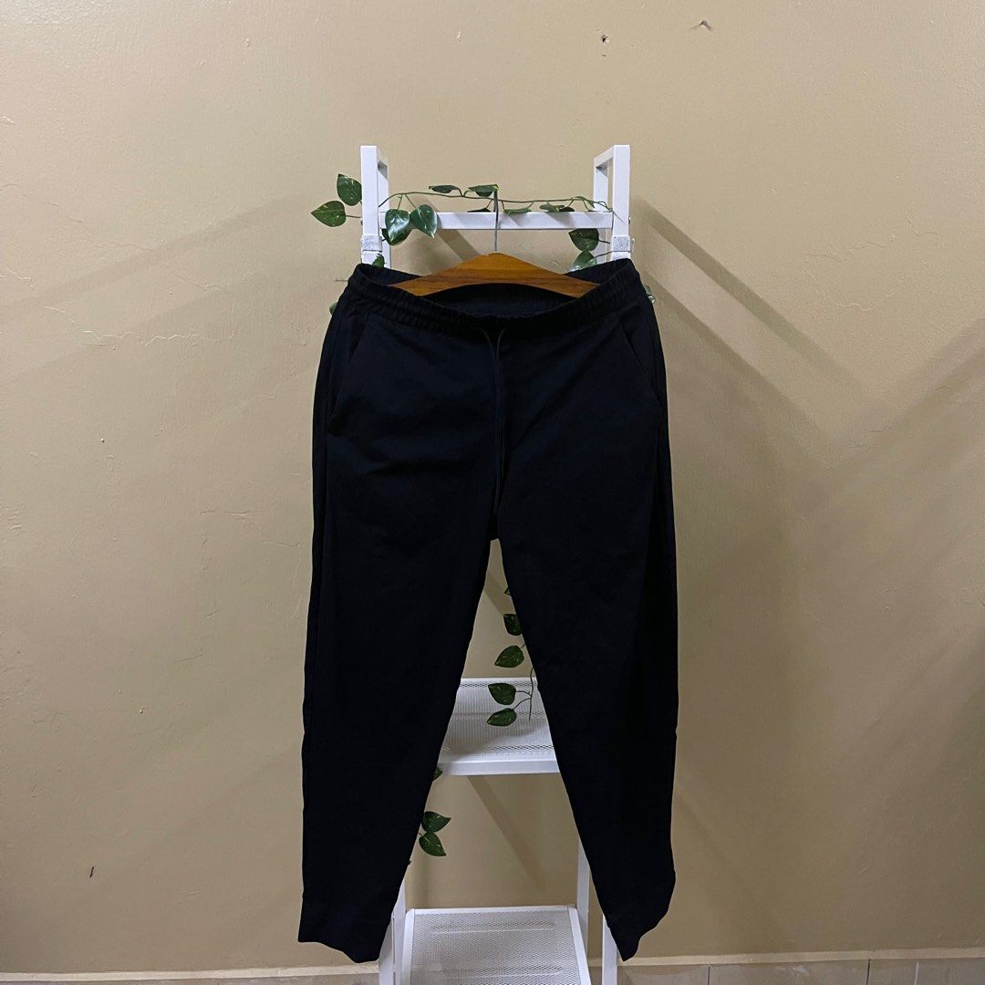 Uniqlo track pants black, Men's Fashion, Bottoms, Joggers on Carousell