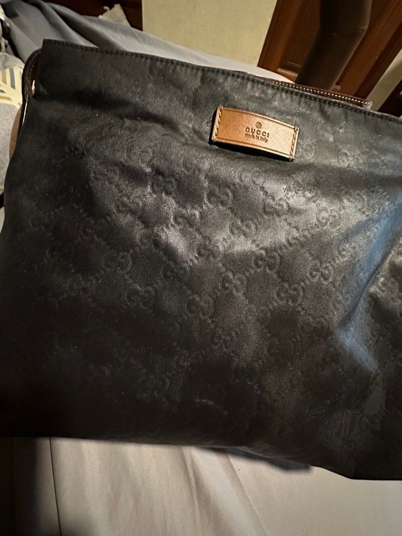 Authentic Gucci unisex sling bag (Category: Luxury Bags & Wallets) located in Quezon City. Submitted by lux4less4u (Listing ID 1214985613, Image 2). Description: This is 100% authentic gucci sling bag. It has been recolor Ed from mustard to color black. It is clean inside and out just a few paint bits in the strap that I think can be removed. Just normal signs of usage great for everyday bag. .