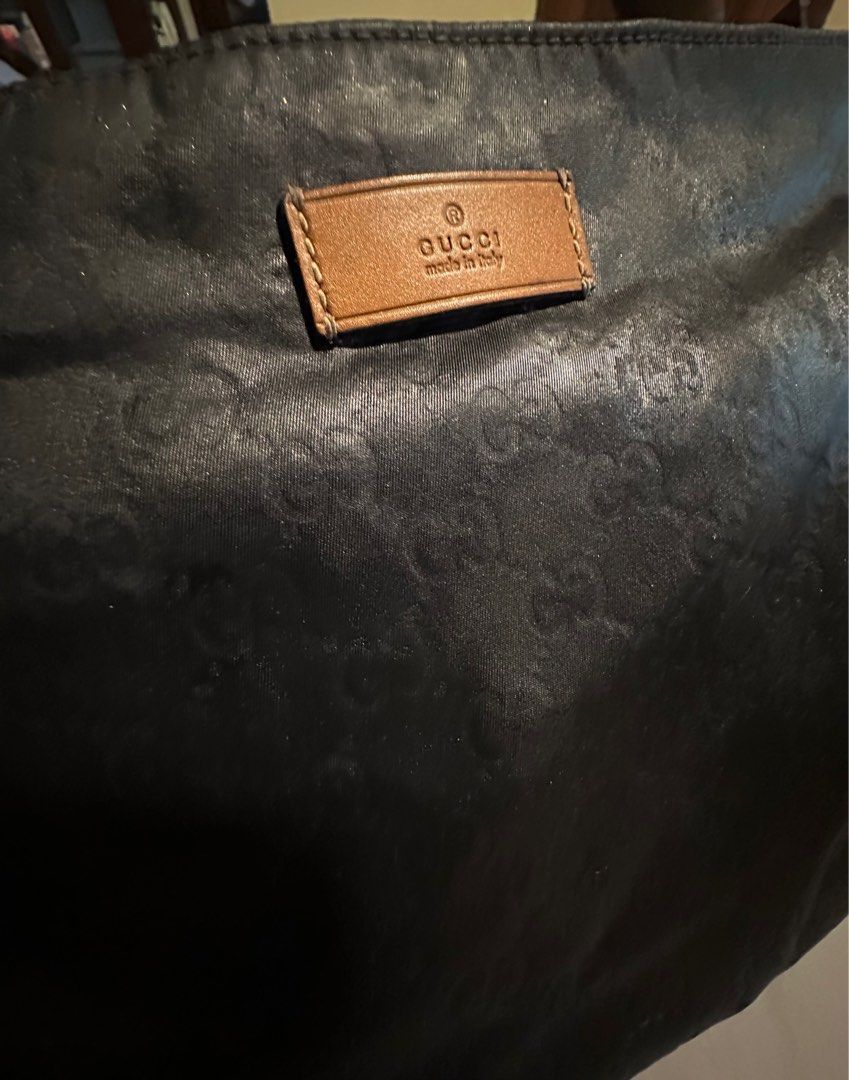 Authentic Gucci unisex sling bag (Category: Luxury Bags & Wallets) located in Quezon City. Submitted by lux4less4u (Listing ID 1214985613, Image 3). Description: This is 100% authentic gucci sling bag. It has been recolor Ed from mustard to color black. It is clean inside and out just a few paint bits in the strap that I think can be removed. Just normal signs of usage great for everyday bag. .