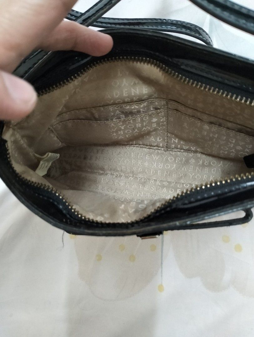 Authentic Kate Spade shoulder bag (Category: Luxury Bags & Wallets) located in Dagupan City. Submitted by nmcmp4 (Listing ID 1214978826, Image 3). Description: Authentic Kate Spade shoulder bag black no box and dustpouch may mga thread lines lang due to prolonged storage konting linis lang.