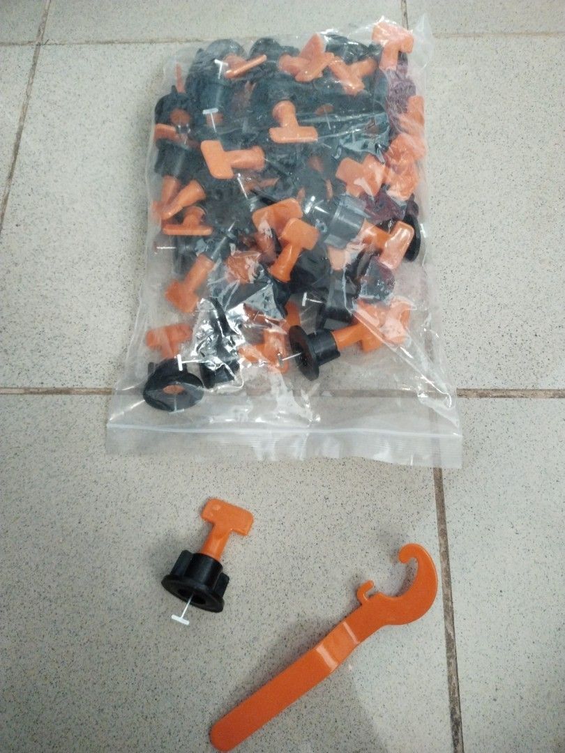 Tile levelling set 50pcs (brand new) (Category: Construction & Building Materials) located in Quezon City. Submitted by dcmarvels (Listing ID 1215024130, Image 2). Description: Tile levellig system to remove lippage / unevenness during laying of tiles in both floor and wall. Guarantess flatness of the tiled surface. Also helps in avoiding movement of tiles during mortar / adhesive setting. Clips and Wedges made with high quality PP material. Plie