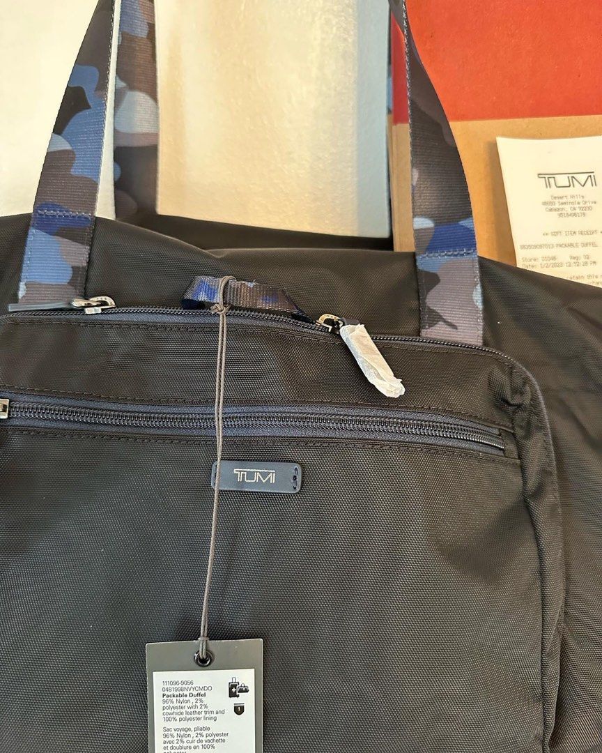 TUMI Packable Foldable Duffle Bag (Category: Shoulder Bags) located in San Pedro. Submitted by anne.studio (Listing ID 1214978362, Image 2). Description: On hand TUMI Packable Foldable Duffle Bag Material: Nylon Hardware: Silver Exterior Pockets: 1 zip pocket, 1 zip compartment Interior Lining: Nylon Handle: 2 flat handles Closure/Opening: Zip Closure Dimensions: 51.5 x 27.5 x 27.5 cm S.