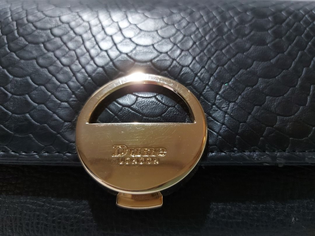 Dune London Long Foldover Wallet | Black (Category: Luxury Bags & Wallets) located in Mandaluyong City. Submitted by mamita14 (Listing ID 1215298893, Image 3). Description: 👛 "ORIGINAL" 👛 1 zipped compartment 👛 Multiple card slots 👛 Alligator textured flap 👛 Dimensions: 20 cm x 10 cm x 2.5 cm 👛 Lightly used and kept in dustbag/storage 👛 Flaws shown in pics (edge peelings).