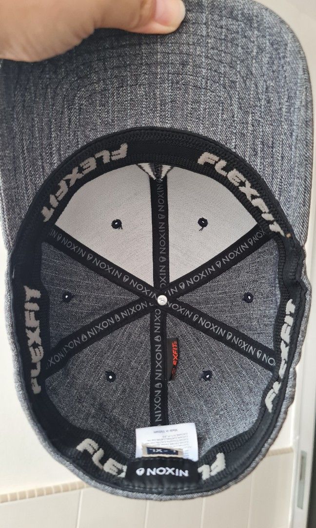 NIXON FLEXFIT Gray soft baseball cap (Category: Caps & Hats) located in Singapore. Submitted by pingerrain (Listing ID 1215243882, Image 2). Description: NIXON FLEXIFIT Gray soft fabric Baseball cap Size L-XL Brand new Condition 10/10 As-is ---- Love more than 1 cap? ---- Nov 2023 Promo (ends 30 Nov 2023, 2359hrs, GMT+8): Buy 2, 10% off total Buy 3, 25% off total Buy 4 or more, 30% off total.
