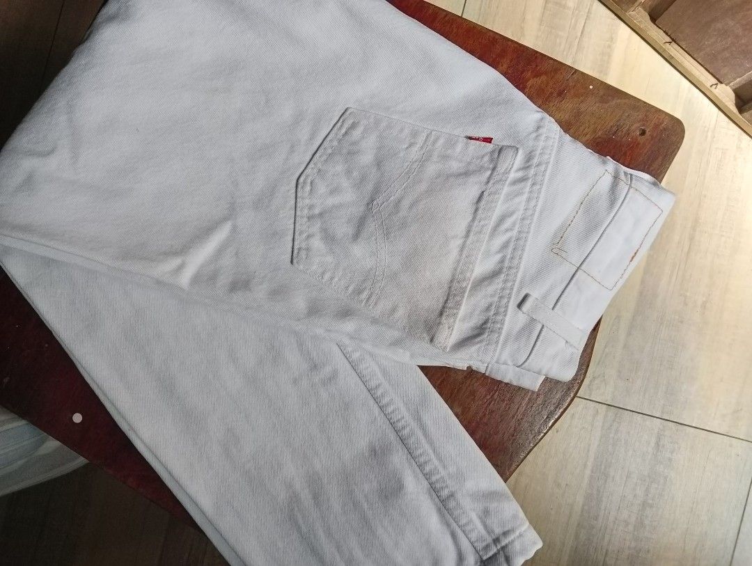 White Levi's Ribcage Buttonfly Jeans (Category: Jeans) located in Taguig. Submitted by jdeclutter__ (Listing ID 1215187376, Image 2). Description: with white faint yellow stains, not noticeable when worn. authentication not guaranteed. straight cut waist 27 length 36.