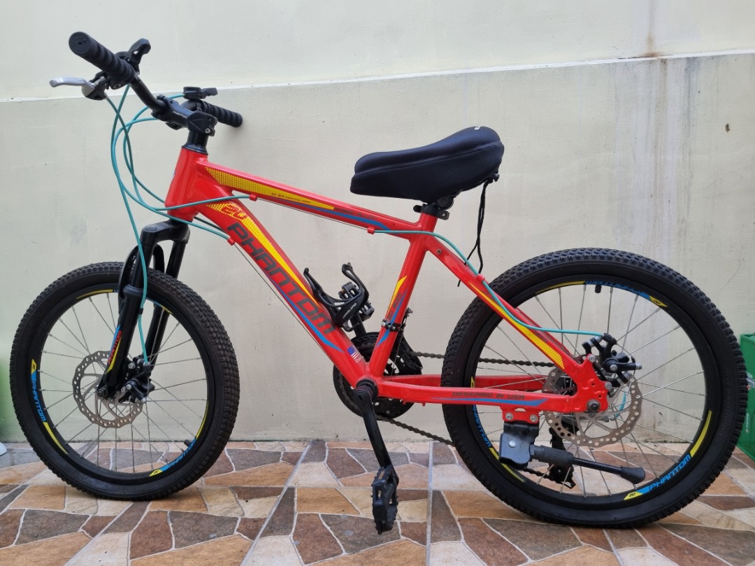 phantom mountain bike for kids with seat cushion and with helmet