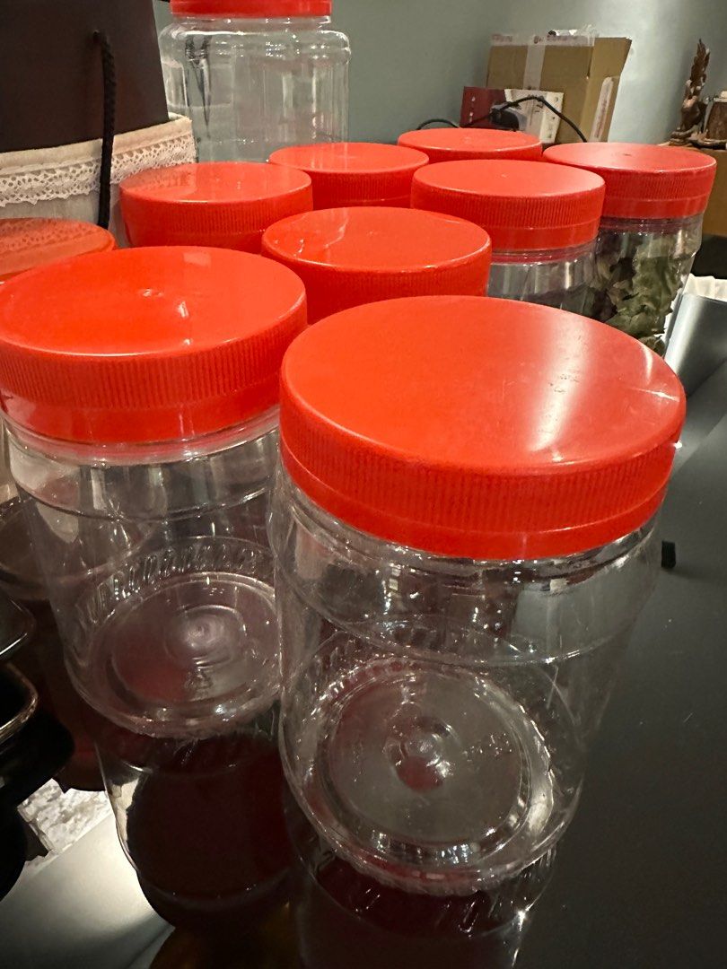 Round plastic container with red lid, Furniture & Home Living