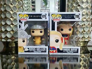 Funko Pop! Friends Pops: Ross Geller as Spudnik (1070) and Phoebe Buffay as Supergirl (705) sold as a pair