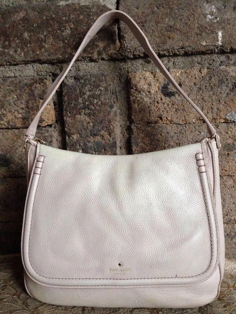 Original Kate Spade Shoulder Bag (Category: Shoulder Bags) located in Marikina City. Submitted by arrveefm (Listing ID 1215515762, Image 2). Description: Selling at Php 1,500.00 (Shipping NOT YET Included) FIXED PRICE!!! We do not entertain hagglers. -- In tagalog bawal "TUMAWAD". If you are too fancy or very attentive to detail (in other words "MAARTE"), this bag is NOT for you (refer to last picture). "Never expect flawless quality from Used/Pr