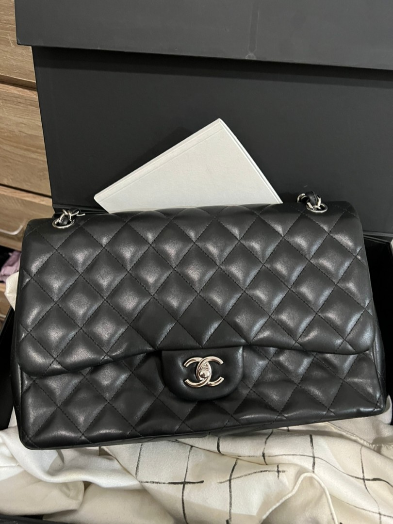 Chanel Jumbo classic flap bag black caviar with silver hardware, black  leather moto jacket with oversized gray scarf and skirt winter oufit, how  to layer with a leather jacket - Meagan's Moda