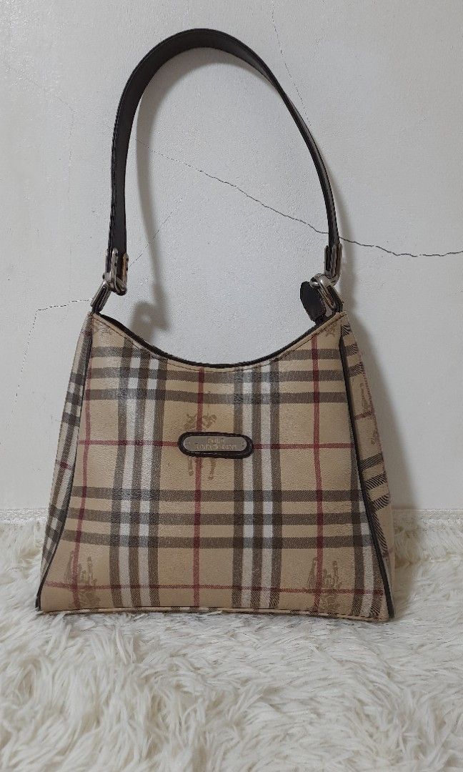 💕Preloved POLO Santa Roberta Shoulder bag (Category: Luxury Bags & Wallets) located in Santa Rosa. Submitted by Zophahollic (Listing ID 1215678268, Image 1). Description: ✅️ Very nice in actual,.like burbery😃 ✅️ PvC material ✅️ Medium size, zipper closure long handle shoulder bag ✅️ with flaws, few lines on the side, holes on thw bottom,little penmark near the plate.
