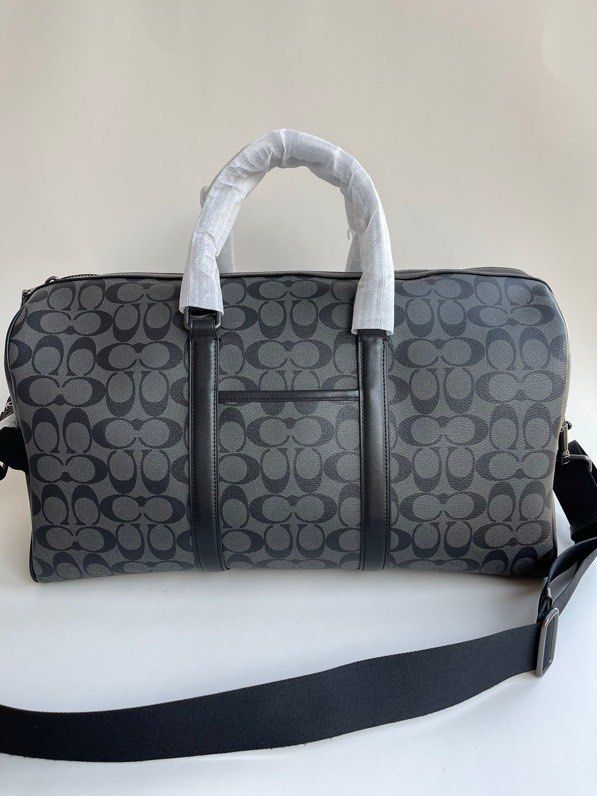 Coach voyager bag in signature canvas sales