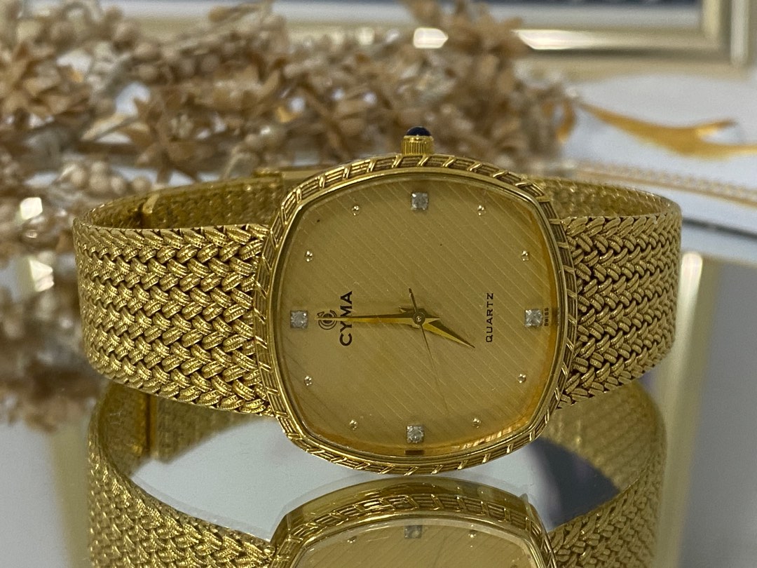 Cyma quartz gold watch hotsell