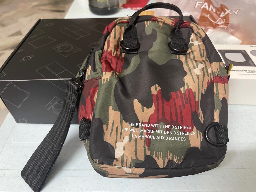 Adidas originals x pharrell williams hu camo mini backpack discount