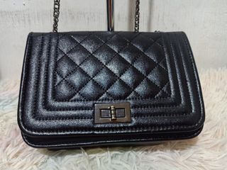 Black quilted leather sling bag