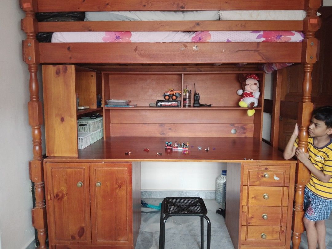 Bunk bed with study table (Category: Bed Frames & Mattresses) located in Subang Jaya. Submitted by sriyaram (Listing ID 1215973149, Image 1). Description: solid wood Australia imported bunk bed (2 SETS AVAILABLE) with storage space, 2 removable book shelf and table top..