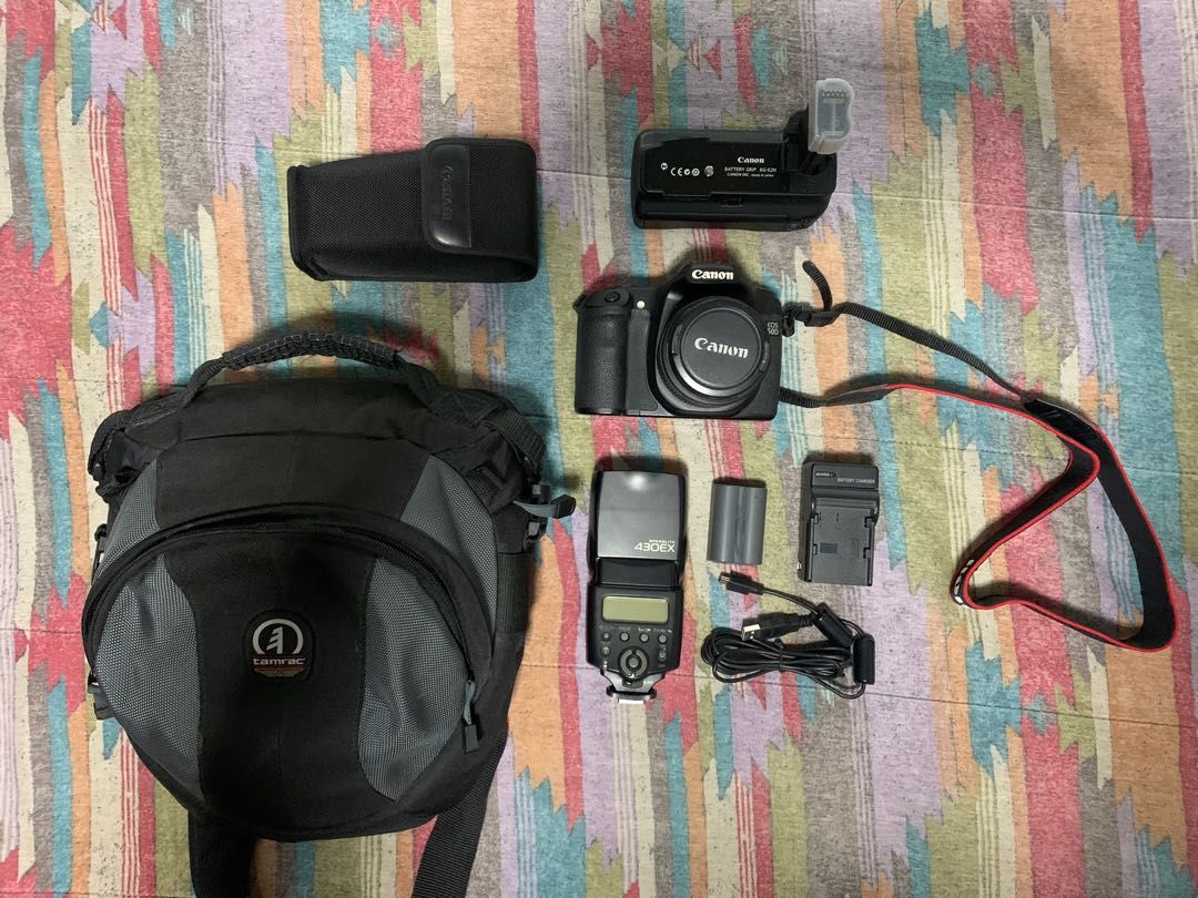 Canon EOS 50D (Category: Cameras) located in Quezon City. Submitted by hellogoodbri (Listing ID 1215875991, Image 1). Description: For Sale: Canon EOS 50D - Mint condition - Sold as pack: •comes with bag, batteries, battery charger, battery grip, external flash, usb cable - Lens model is EFS 18-55mm - Flash model is Canon Speedlite 430EX - Issue: plastic crack on the side (see last photo); does not affect function and performance. - Negotiable - 