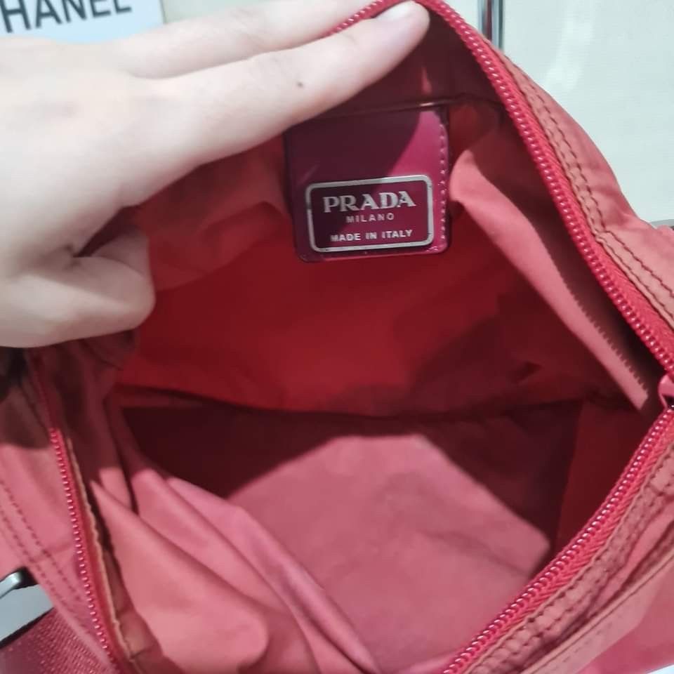 Prada Nylon Sling (Category: Luxury Bags & Wallets) located in Caloocan City. Submitted by lujosacollection (Listing ID 1215974843, Image 2). Description: 100%Authentic/Original Preloved Prada Nylon Sling Good condition No inclusion.