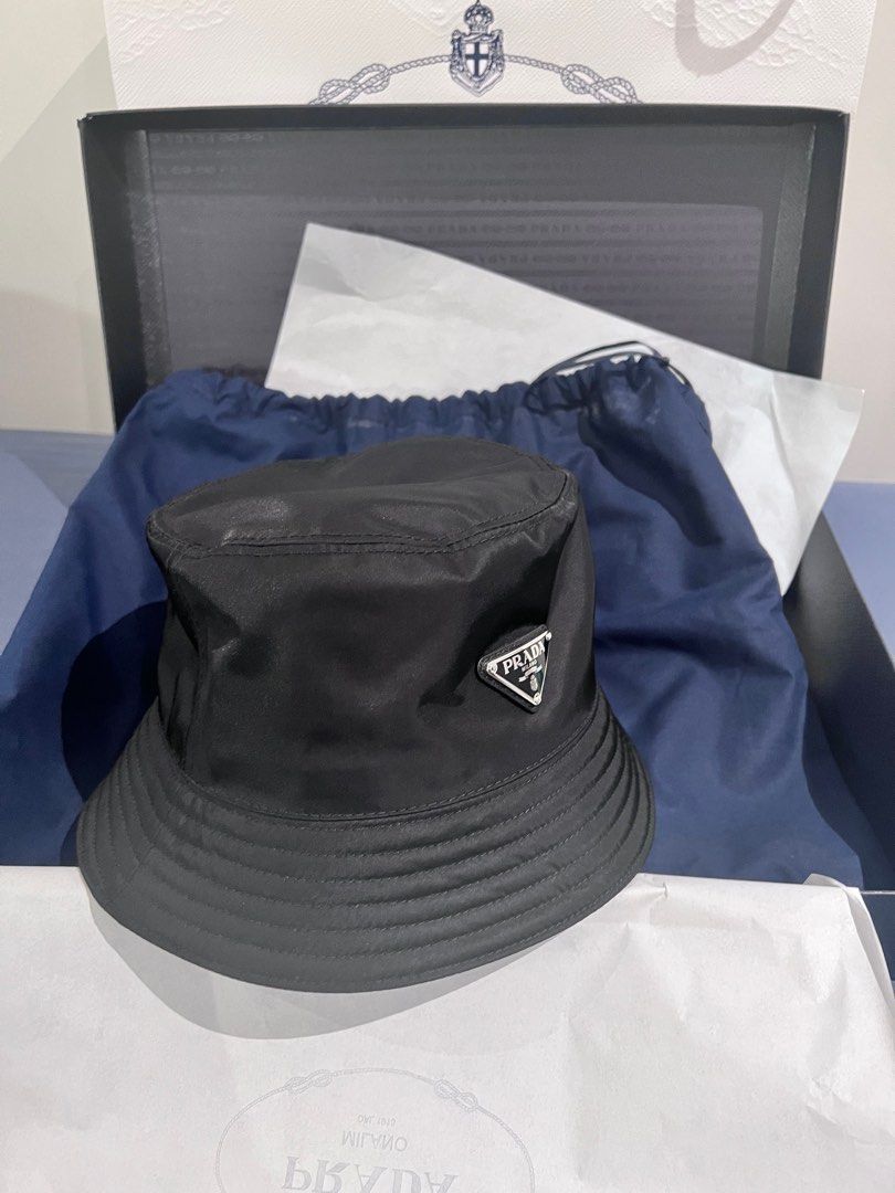 Prada Re-Nylon bucket hat with paper bag, gift box & certificate , Men's  Fashion, Watches & Accessories, Caps & Hats on Carousell