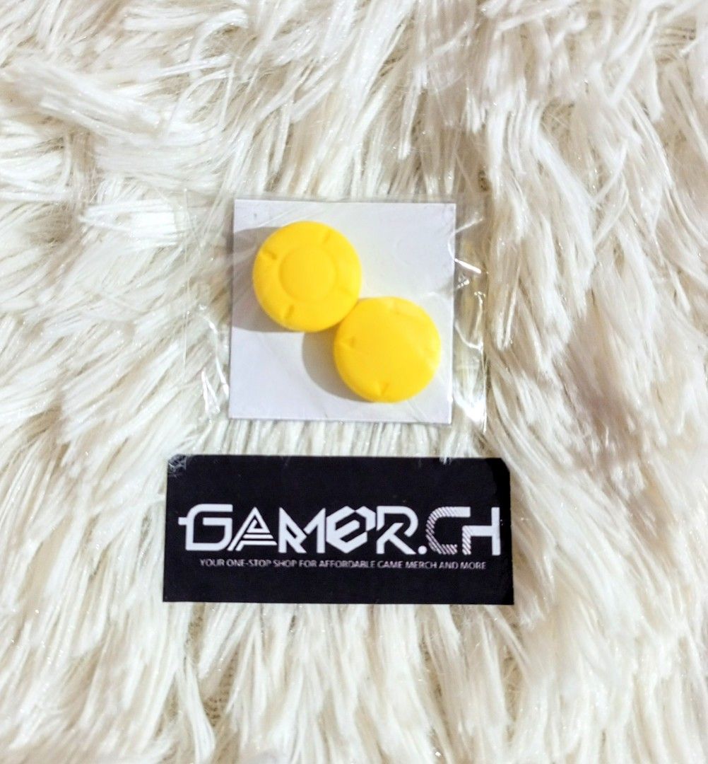 Yellow Thumbgrips for Nintendo Switch (Category: Cases & Covers) located in Marikina City. Submitted by gamerch. (Listing ID 1216043394, Image 1). Description: One of my beloved thumbgrips from my collection, can't remember what brand tho since this didn't come in any brand packaging. I also have a pink pair of these in another listing, go check that out if you're interested 🥰 Price: 50 FIXED Condition: Brand New, tinago lang sama ng ibang thumb