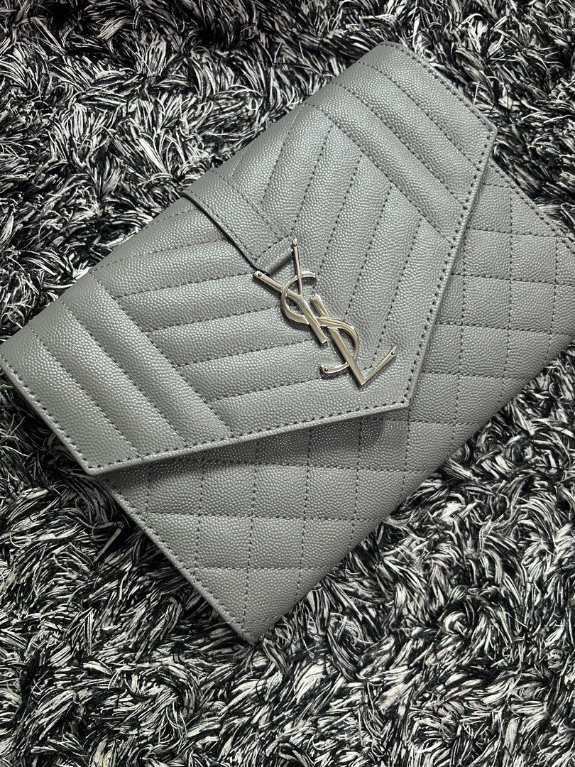 YSL clutch (Category: Luxury Bags & Wallets) located in Quezon City. Submitted by luxury.xy (Listing ID 1215933433, Image 2). Description: 100% authentic and brand new YSL clutch; you may buy a chain strap to convert it as a WOC😊 With cards, dust bag Bought from Australia .