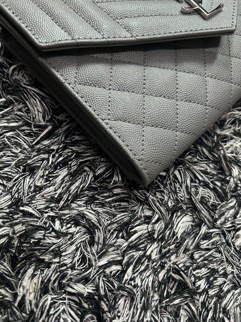 YSL clutch (Category: Luxury Bags & Wallets) located in Quezon City. Submitted by luxury.xy (Listing ID 1215933433, Image 3). Description: 100% authentic and brand new YSL clutch; you may buy a chain strap to convert it as a WOC😊 With cards, dust bag Bought from Australia .