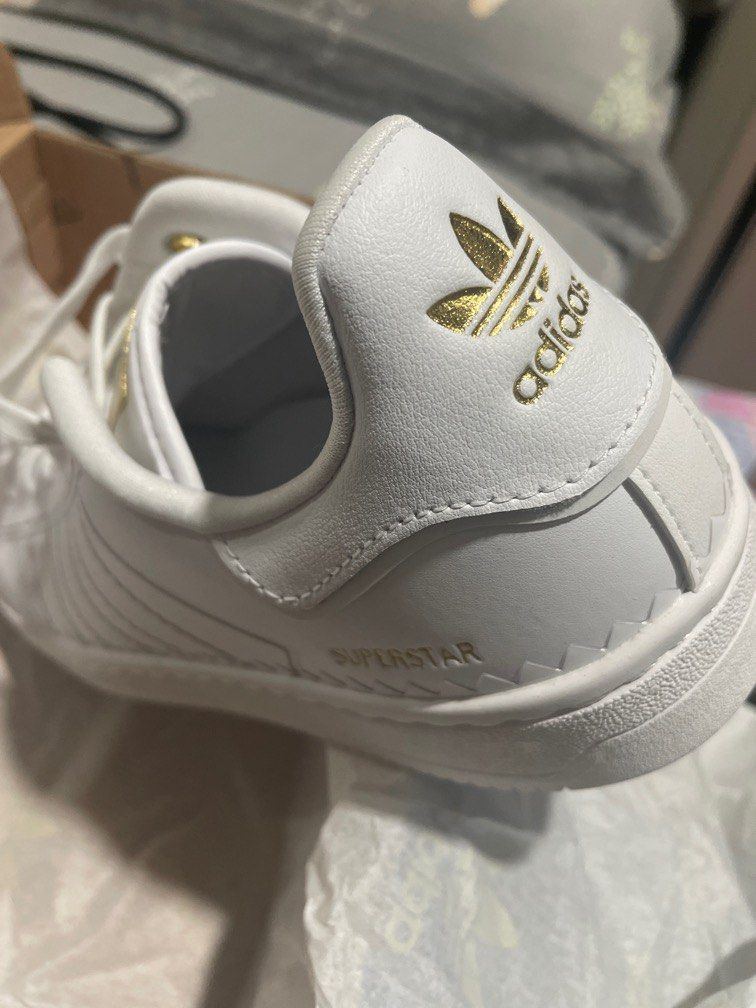 White sneakers cheap with gold accents