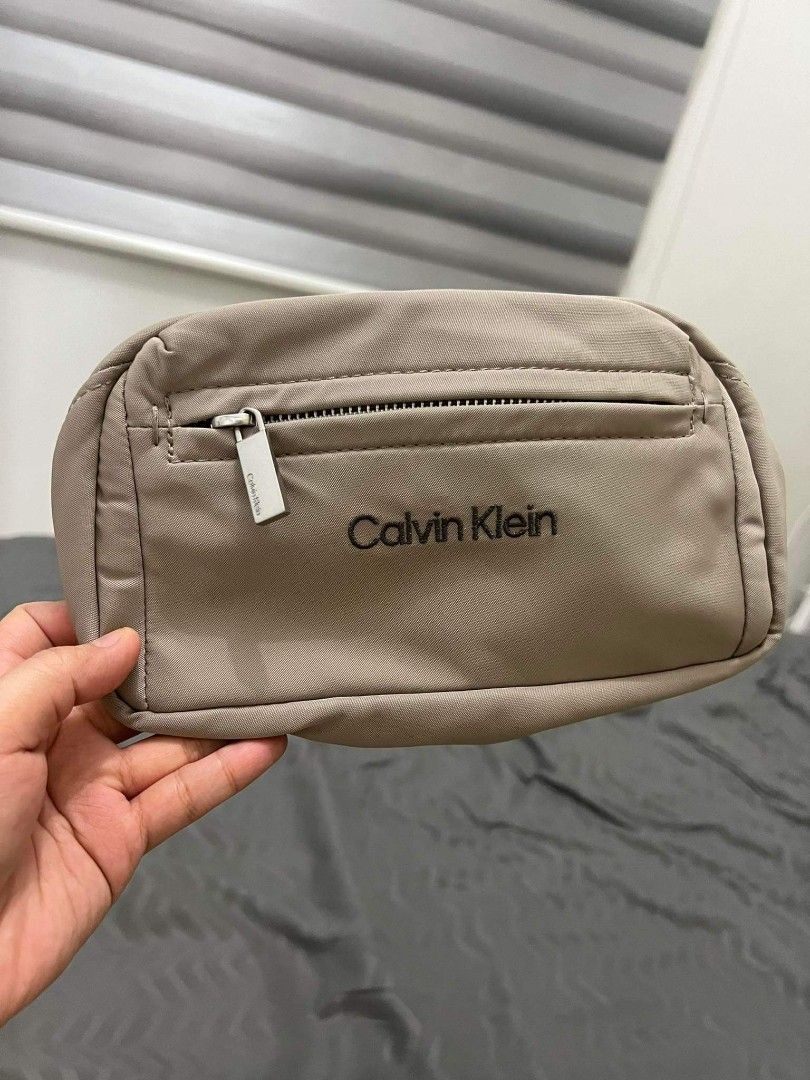 Calvin Klein Medium Beige Cosmetic Bag, Luxury, Bags & Wallets on Carousell