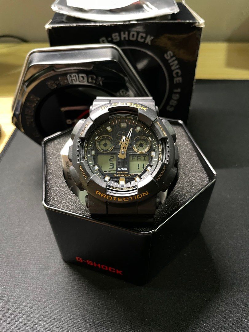 Casio G Shock GA100 GBX black gold