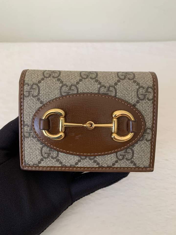 Gucci Horsebit 1955 Compact Wallet (Category: Luxury Bags & Wallets) located in Manila. Submitted by bagislifeshop (Listing ID 1212970588, Image 2). Description: Gucci Horsebit 1955 Compact Wallet ☑️Available in Pampanga ✅Condition: 8.8/10 ✅Material: Beige/ebony GG Supreme canvas, Brown leather in GHW ✅Size: Open: 4.3"W x 6.9"H, Closed: 4.3"W x 3.3"H x 1.2"D ✅Inclusions: Cards, dustbag, box, booklets and receipt.