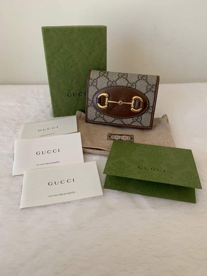 Gucci Horsebit 1955 Compact Wallet (Category: Luxury Bags & Wallets) located in Manila. Submitted by bagislifeshop (Listing ID 1212970588, Image 1). Description: Gucci Horsebit 1955 Compact Wallet ☑️Available in Pampanga ✅Condition: 8.8/10 ✅Material: Beige/ebony GG Supreme canvas, Brown leather in GHW ✅Size: Open: 4.3"W x 6.9"H, Closed: 4.3"W x 3.3"H x 1.2"D ✅Inclusions: Cards, dustbag, box, booklets and receipt.